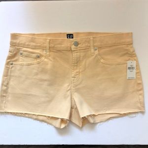 NWT GAP pale yellow denim raw edge shorts size 29